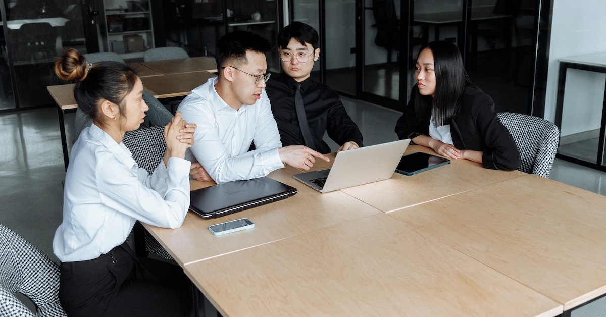 people having a meeting in a corporate office